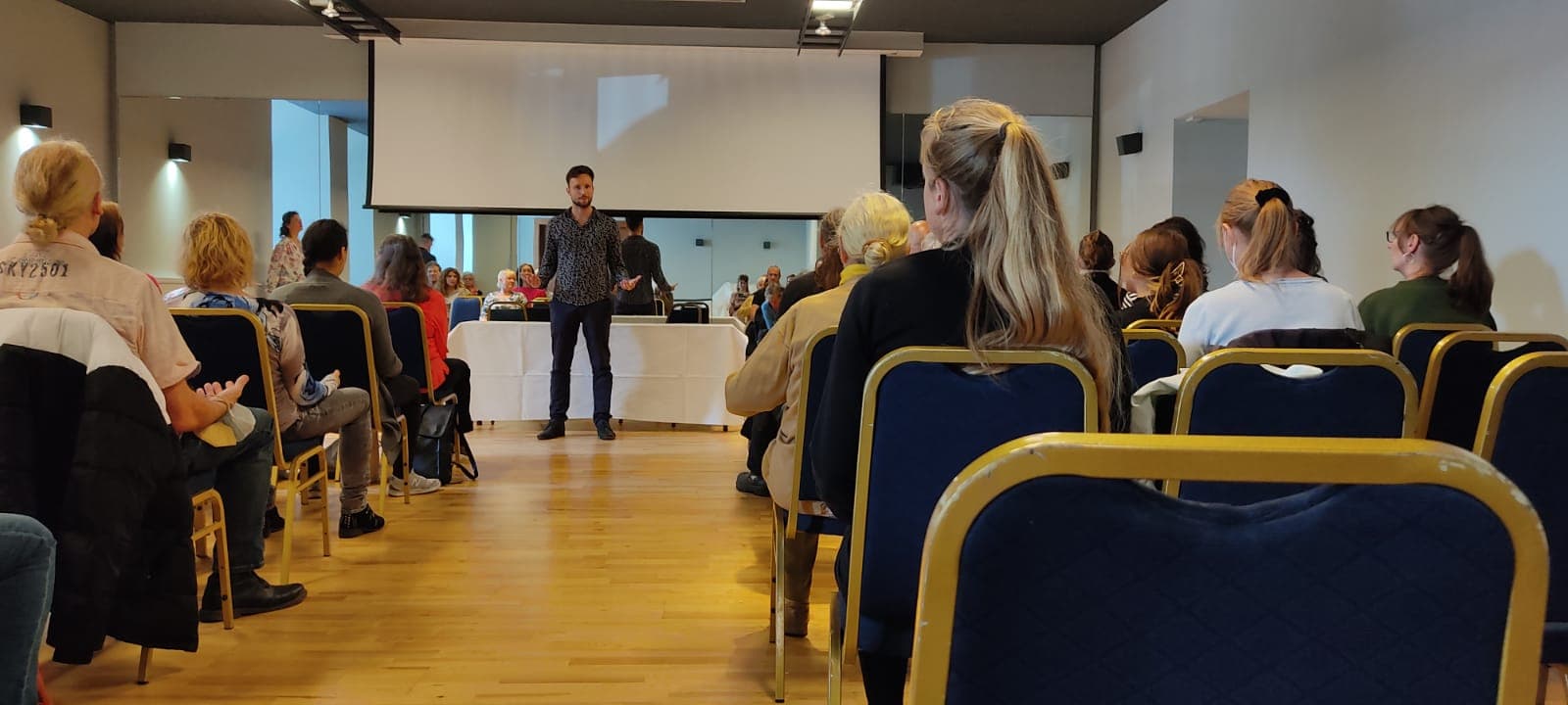 Marian leading a meditation event with 70+ attendees